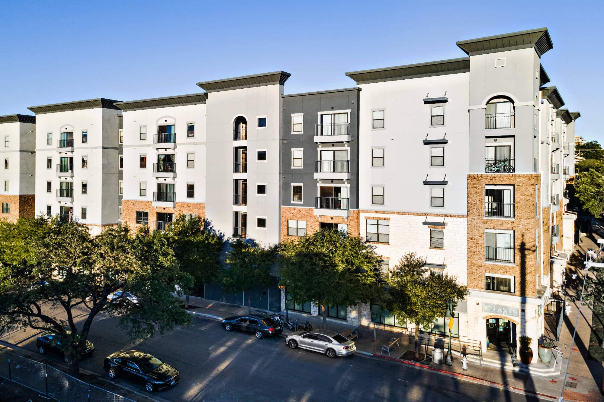 axis west campus off campus apartments in west campus near ut austin birds eye view of community building exterior street parking